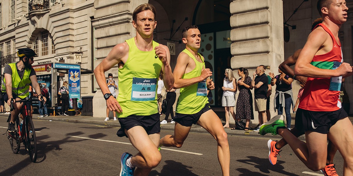 people running along street in fun run