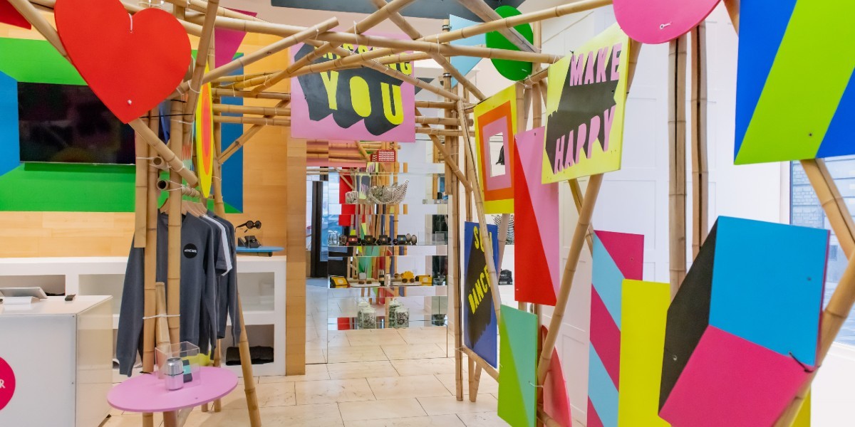Interior of a shop with flags and brightly coloured posters